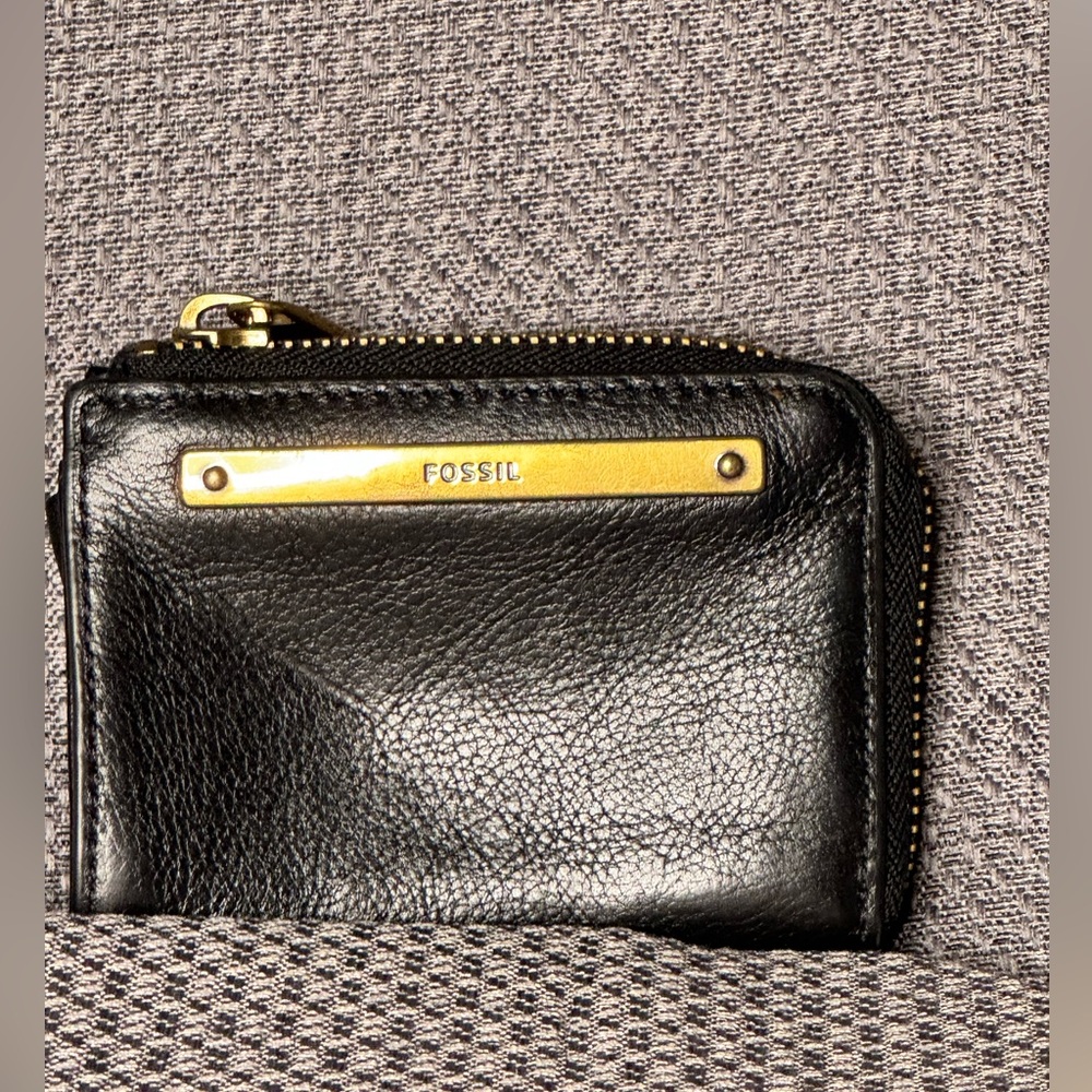 Fossil black leather wallet with antique gold colored hardware